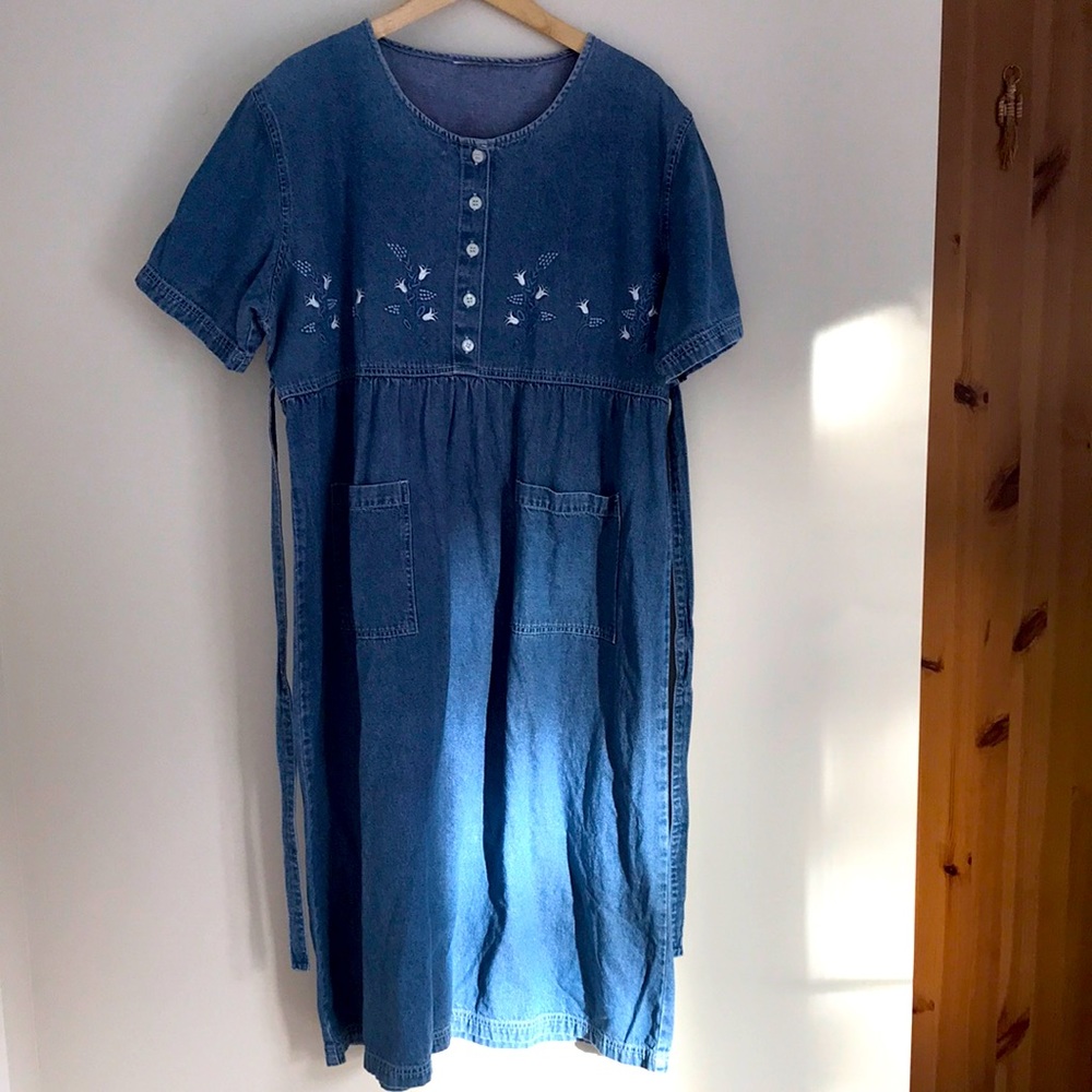 Long denim dress with pockets, waist tie, and floral embroidery
